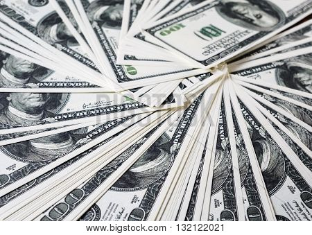 Money as background. One hundred dollars heap. Selective focus.