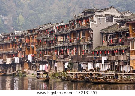 Wooden Rowing Boats With Ancient Architecture In China
