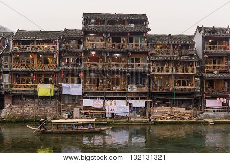 Wooden Boat Sails Past Old City