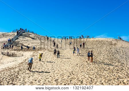 People Visiting The Highest Sand Dune Of Pyla In Europe