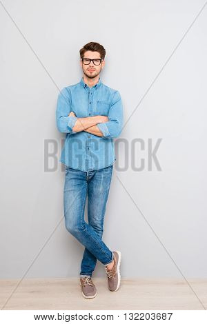 Full Length Portrait Of  Stylish Man In Glasses With Crossed Hands