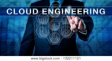 Cloud architect is pressing CLOUD ENGINEERING on an interactive touch screen display. Business metaphor and information technology concept for an engineering approach to cloud computing.