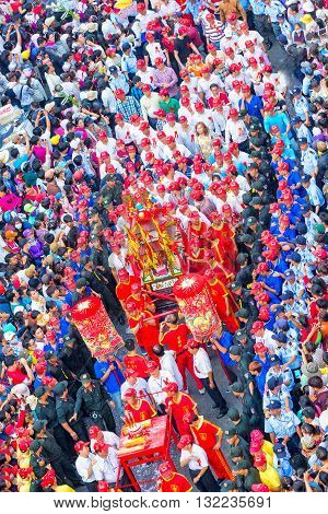 Binh Duong, Vietnam - February 22nd, 2016: Festival Chinese Lantern with colorful procession carrying censer goddess bless business is protected around march on road to pagoda in Binh Duong, Vietnam