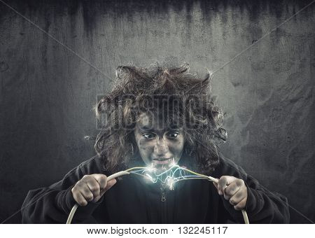 Young girl with messy hair being shocked by electric cable