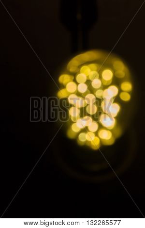 Vintage light bulb in black room stock photo