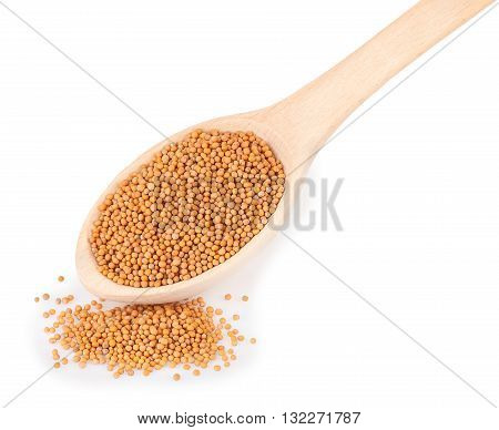 mustard isolated on white. Mustard seeds in wooden spoon isolated on white background. Mustard seeds in wooden spoon