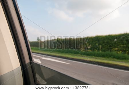 View from the window of a car for a motion blur on the road