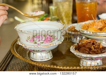 Cooked rice in jasmine water (sometime in rose water) and ice served with side dishes or named in Thai that 
