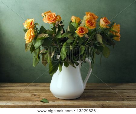 Beautiful rose flower bouquet on wooden table
