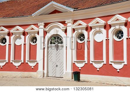 PILSRUNDALE LATVIA - JULY 27 2015: Exterior of the red painted stables building windows next to Rundale palace in Pilsrundale Latvia.
