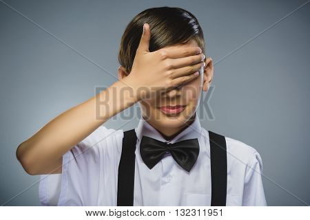 Closeup Portrait of happy boy going surprise isolated on gray background.