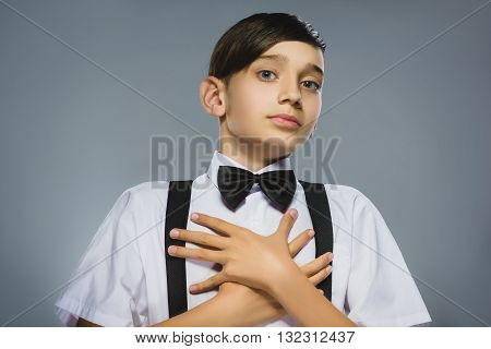 Closeup Portrait of happy boy going surprise isolated on gray background.