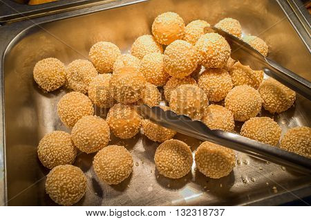 Chinese dessert sesame donuts in self serve buffet tray