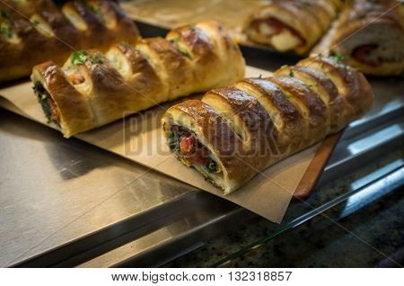 Crispy vegetable cheese stromboli on display at Italian restaurant