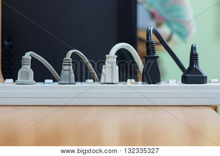 Electrical appliances pluged several adapter and charger.