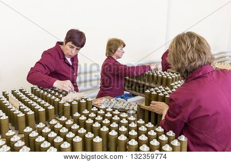 Workers Checking Rpg Explosives In Munition Factory