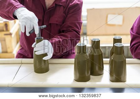 Workers At An Assembly Line In Munition Factory