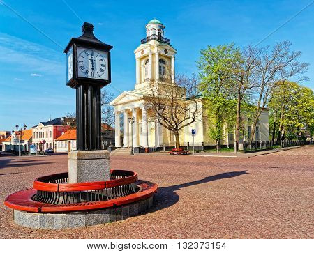 Clock And Lutheran Church Of St Nicholas In Ventspils