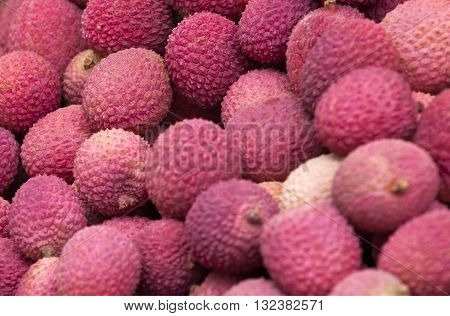 Group of fresh lychee. Organic products on a market