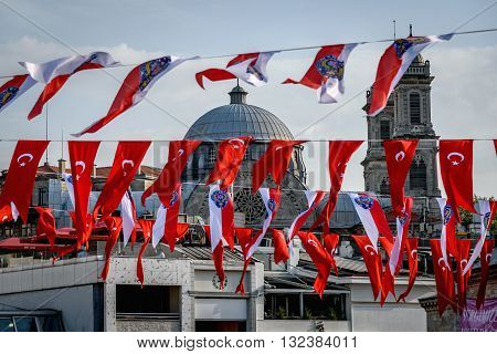 Turkish flags obscecurring the view of mosque in Istanbul Turkey