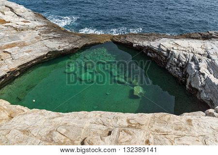 Green waters of Giola Natural Pool in Thassos island, East Macedonia and Thrace, Greece