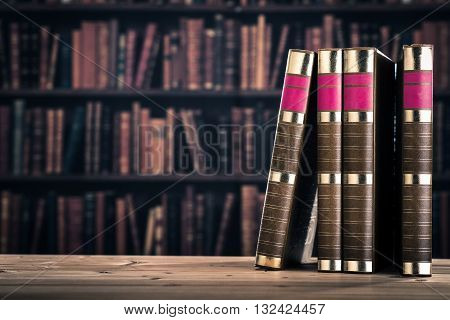 Bookshelf and heavy books on the wood table