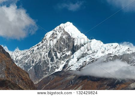 Peaks Of Mountains, Covered By Snow.