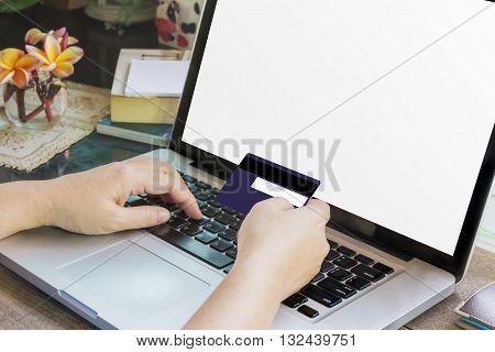 Women Hands Hold Credit Or Debit Card (atm) And Notebook Or Laptop For Internet Working, Online Buyi