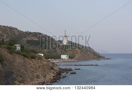 Evening at the sea.Church - Beacon of St. Nicholas of Myra.Malorechenskoye village, near Alushta, Crimea.