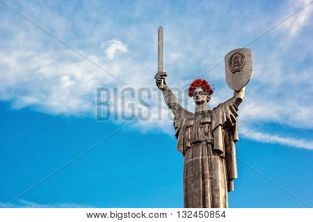 KIEV, UKRAINE - MAY 09: The Motherland Monument also known as Rodina-Mat', decorated with red poppy flower wreath on Victory Day, devoted the Great Patriotic War. May 09, 2016 in Kiev, Ukraine