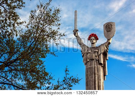 KIEV, UKRAINE - MAY 09: The Motherland Monument also known as Rodina-Mat', decorated with red poppy flower wreath on Victory Day, devoted the Great Patriotic War. May 09, 2016 in Kiev, Ukraine