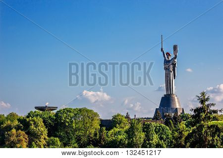 KIEV, UKRAINE - MAY 09: The Motherland Monument also known as Rodina-Mat', decorated with red poppy flower wreath on Victory Day, devoted the Great Patriotic War. May 09, 2016 in Kiev, Ukraine