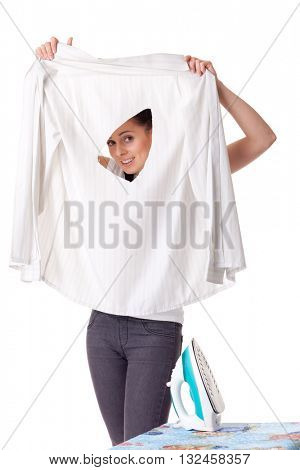 Young woman with shirt and iron on a white background. Housekeeping.