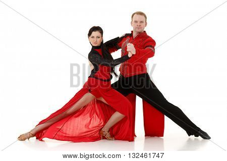 Dancing young couple on a white background.
