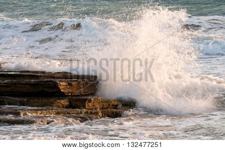 Dangerous Waves crashing with power on sea rocks.
