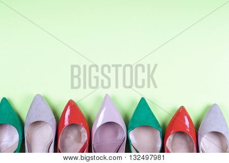 set of different shoes Shot of several types of shoes Several designs of women shoes. Leather Shoe. Pile of various female shoes on light background. Copy space for text.