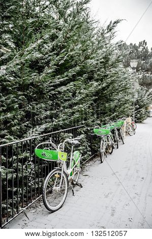 STRASBOURG FRANCE - JAN 20 2016: VelHop rent a bike system in the snowy French streets of Strasbourg Alsace