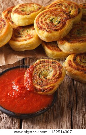 Sliced Potato Rolls With Tomato Sauce Close Up. Vertical