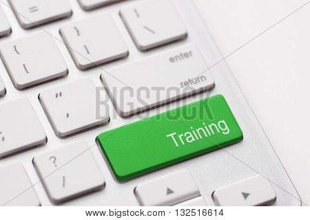Education concept: computer keyboard with word Training on enter button