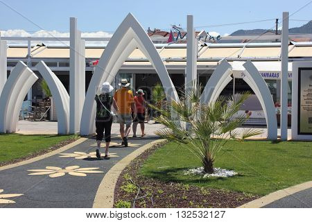 25TH MAY 2016,FETHIYE,TURKEY:English tourists visiting  Fethiye's Ozgecan Aslan Memorial Park ,The park is a tribute to the young girl who was tragically murdered on February 11th 2015 in Mersin.The park is along the promenade at Fetheye in Turkey, 25th m