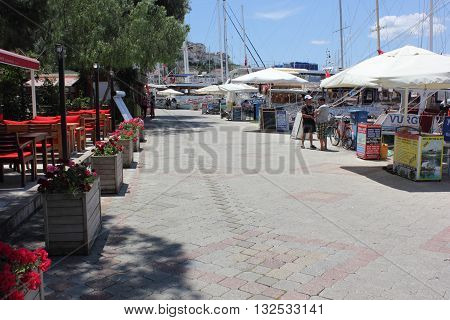 1ST AUGUST 2016,CALIS,TURKEY:  The promenade with resturants and boats for hire in Fethiye in Turkey, 1st august 2016