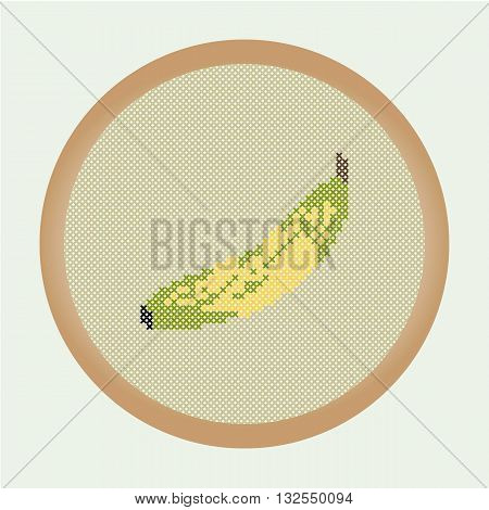 Embroidery banana. Vector illustration: the banana which is cross stitched in a round frame