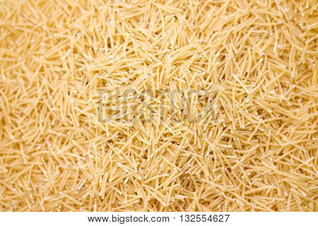 Raw vermicelli pasta background. Pasta Vermicelli texture background. Traditional Italian food.