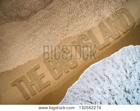 The Big Island written on the beach