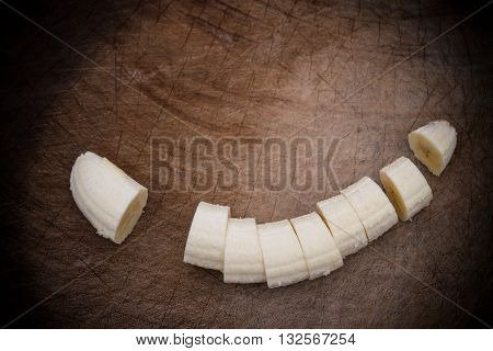 banana slices on a wooden chop board