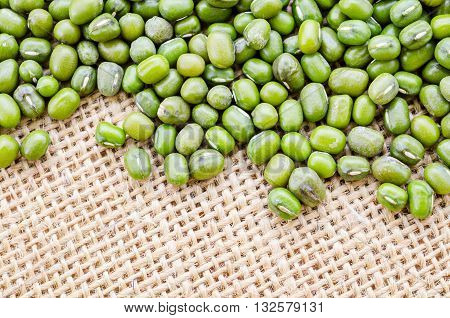 The Mung bean seeds on sack background.