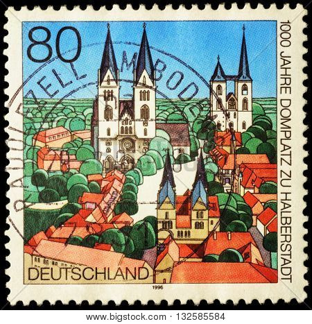 MOSCOW RUSSIA - JUNE 02 2016: A stamp printed in Germany shows the ancient German city devoted to the 1000th Anniversary of the Cathedral Square in Halberstadt circa 1996