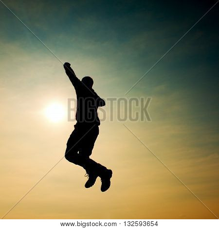 Flying Man. Young Man Falling Down On Sky Background.