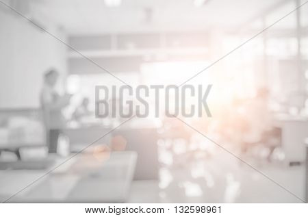 Businessmen blur in the workplace.Table Top And Blur Office of Background.abstract blur background table work in office with computer.Abstract background of office shallow depth of focus.