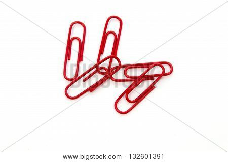 Red paper clip isolated on white background